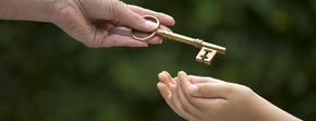 adult hands key to child Law Office of Marc Andrew Moses