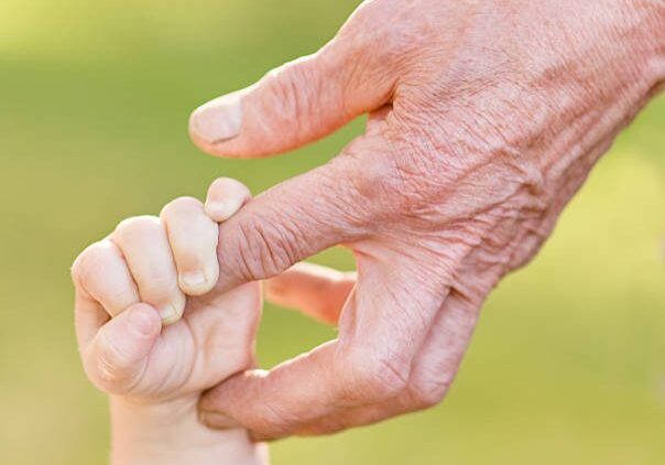 old man and a kid holding hands together Law Office of Marc Andrew Moses